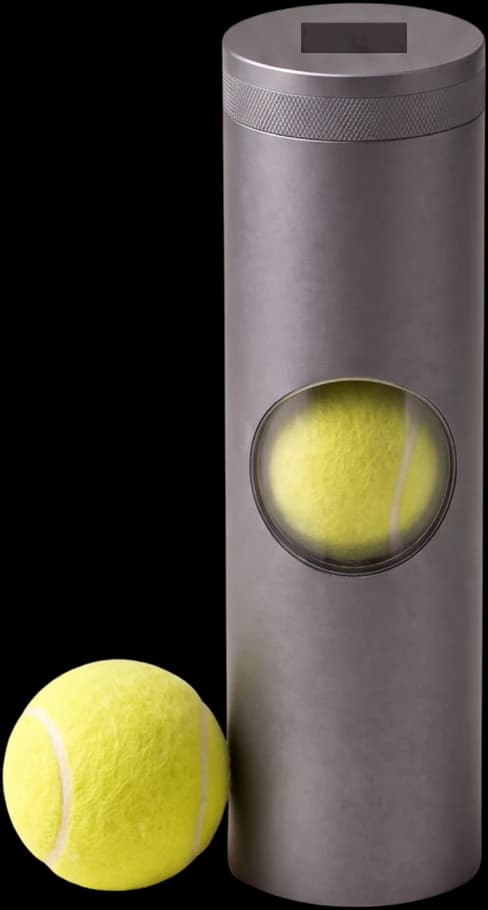 The otennis device standing beside a tennis ball.